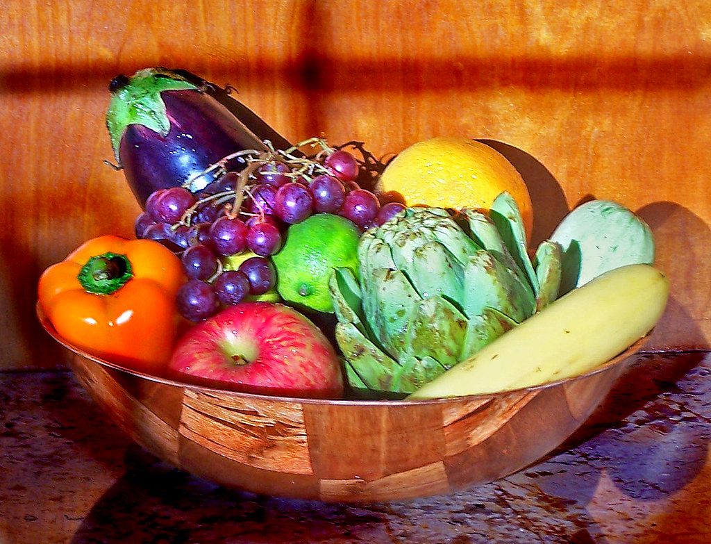 A bowl of colourful fresh fruit and vegetables