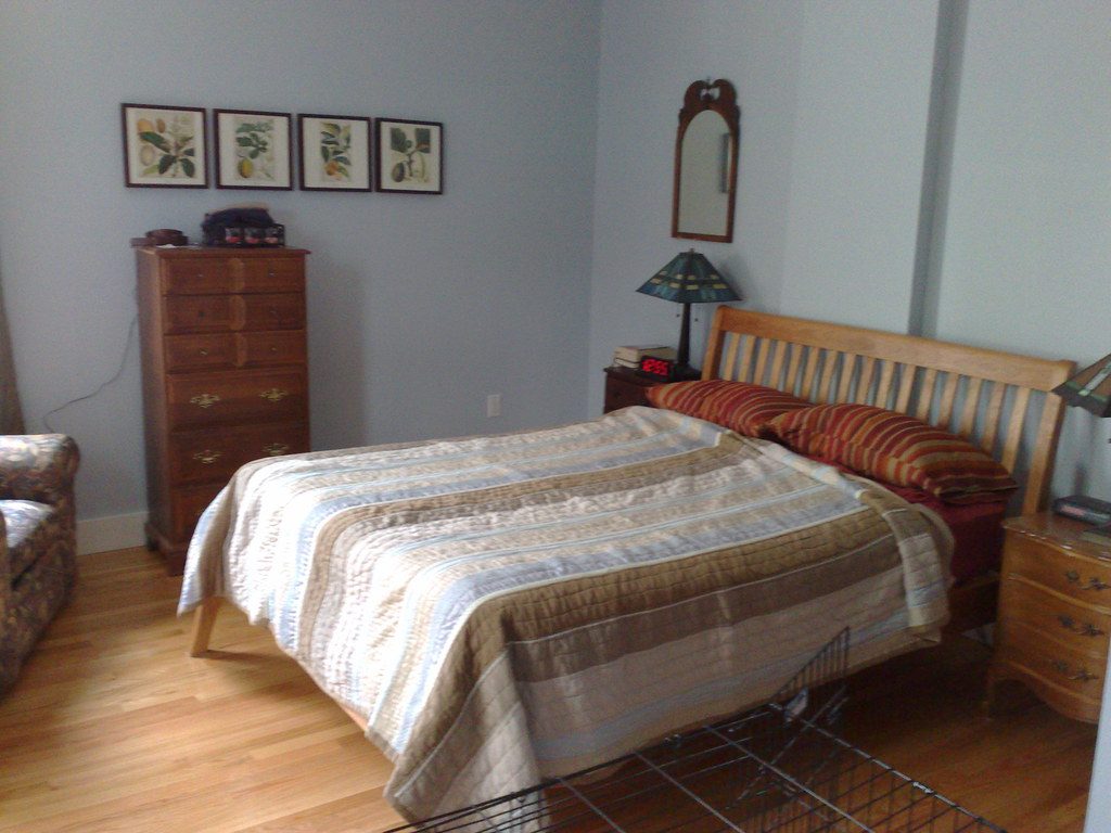 A calm, freshly made bed with soft pillows