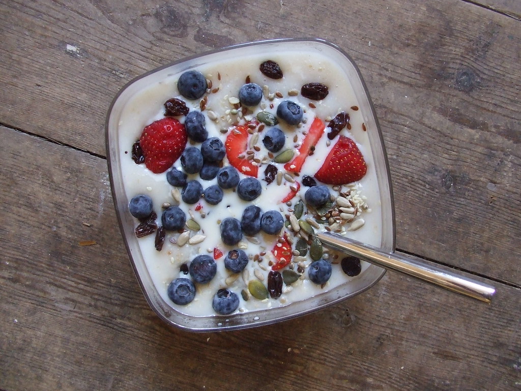 A breakfast bowl with berries and seeds